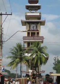 The tall Ghantaghar (clock tower) in the middle of the busy city is a dominant landmark .